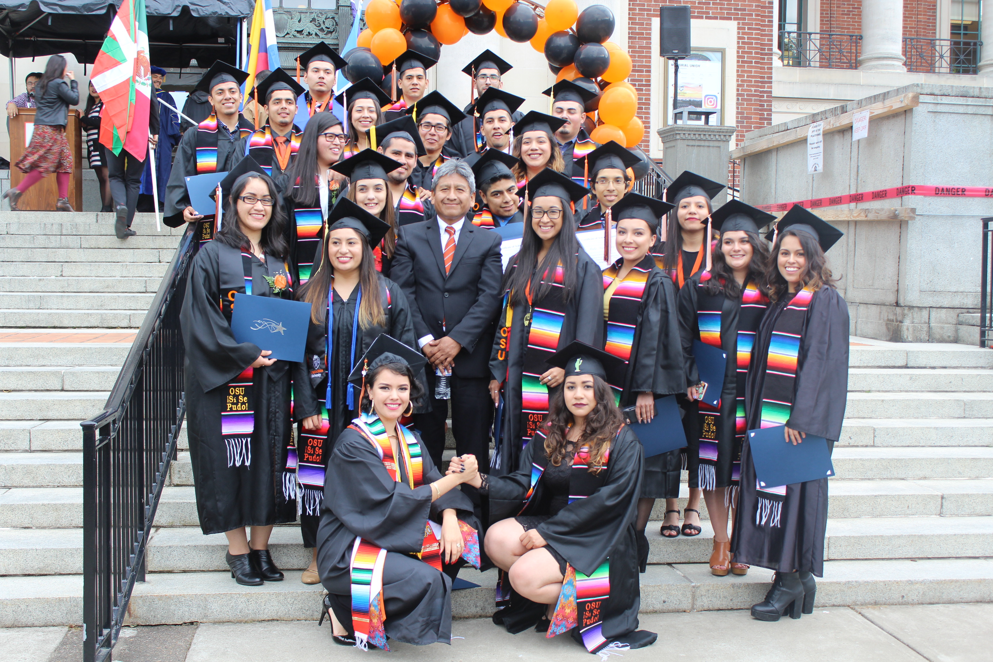 photo of CAMP director with graduates